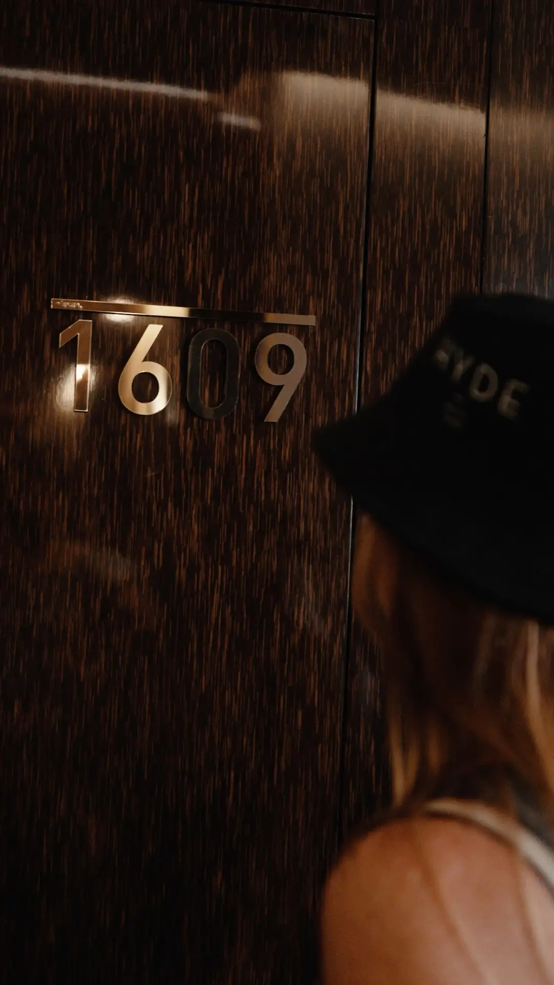 Hyde Hotel Dubai room signage with a branded bucket hat